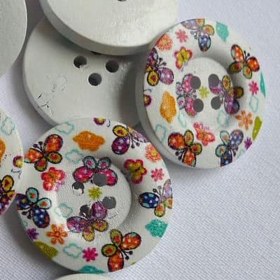 Wooden button printed with colored butterflies