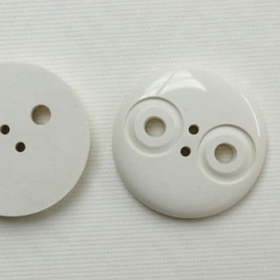 White polyester button