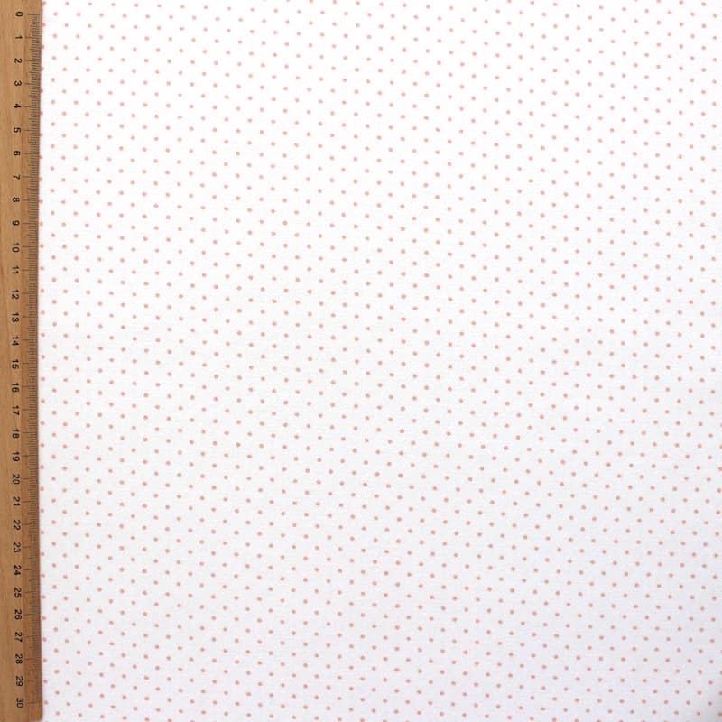 Tissu en coton imprimé de petits pois sur fond blanc