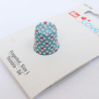 Blue thimble with red and white dots
