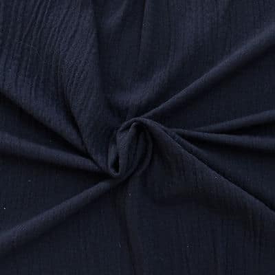 Navy blue wool and acryl fabric crumbled up