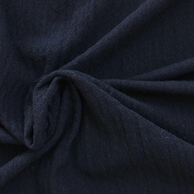 Navy blue wool and acryl fabric crumbled up