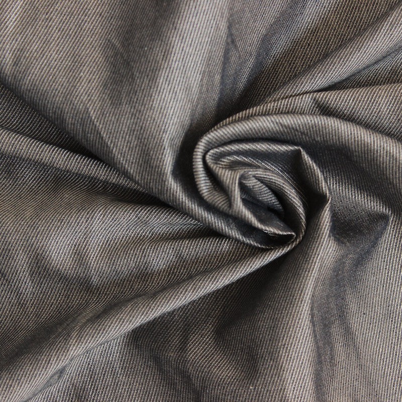 Tissu en coton fond beige effet métal noir