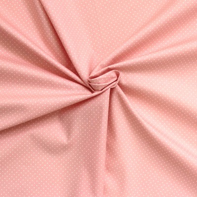 Tissu en coton à pois sur fond rose