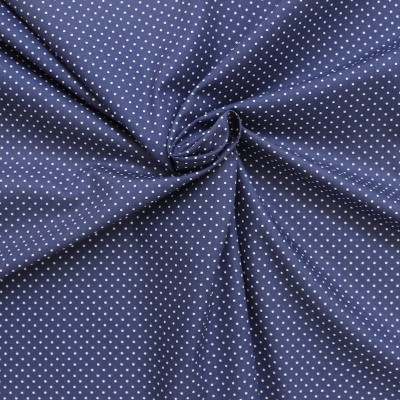 Tissu en coton à pois sur fond bleu 