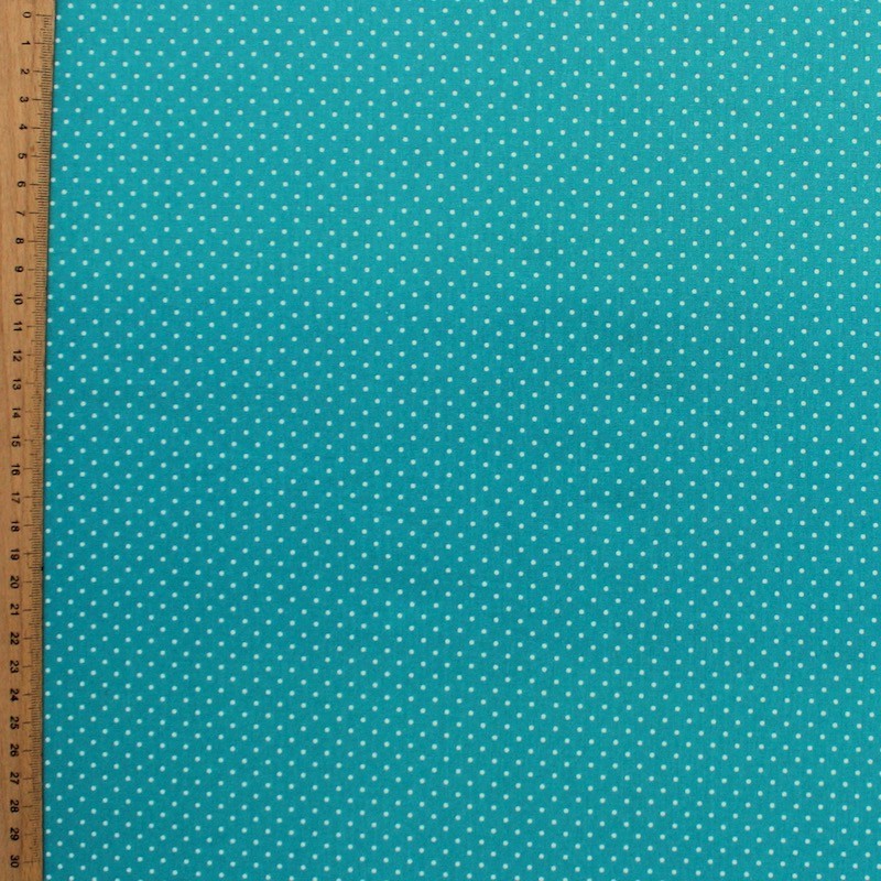 Tissu en coton à pois sur fond bleu turquoise
