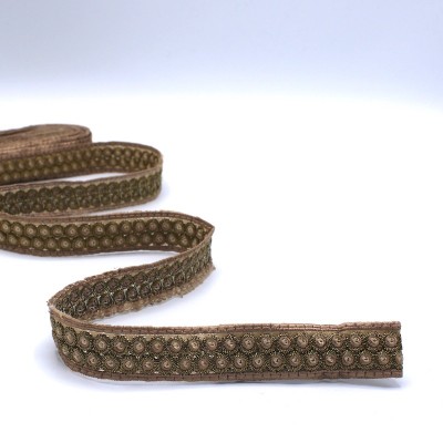 Embroided braid trim with beige and golden glitters 