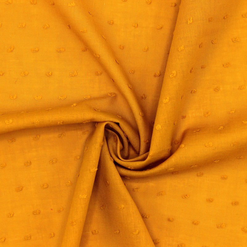Tissu coton safran à plumetis