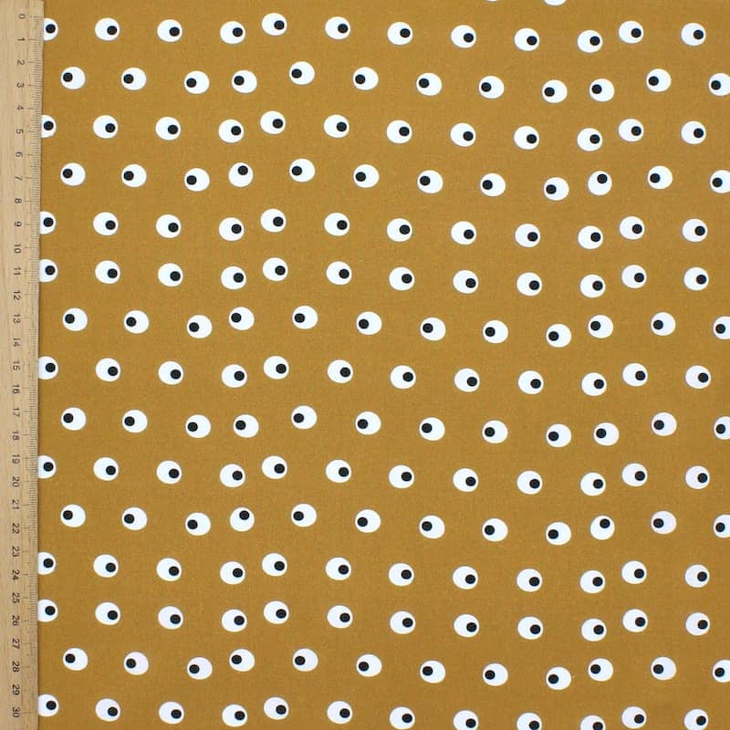 Tissu en coton imprimé sur fond moutarde