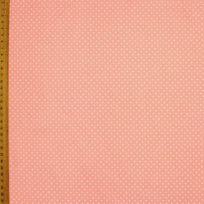 Coated cotton with dots - pink background