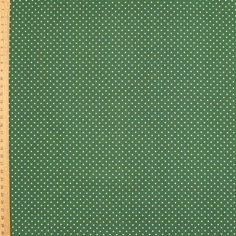 Tissu en coton à pois sur fond vert 