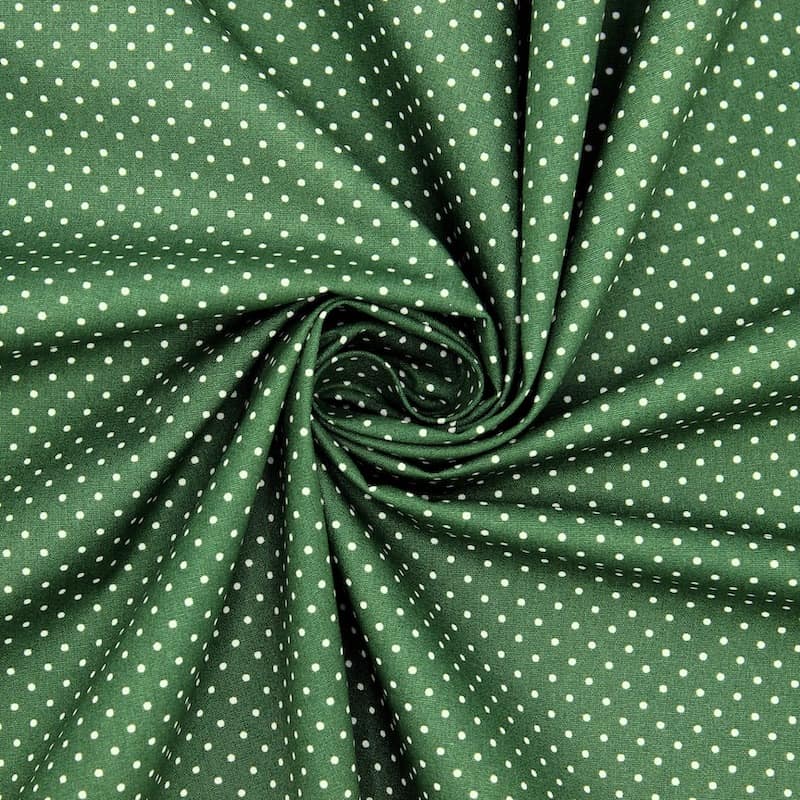 Tissu en coton à pois sur fond vert 