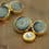 Button with golden metal and verdigris aspect