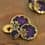 Round resin button with golden metal and byzantin purple