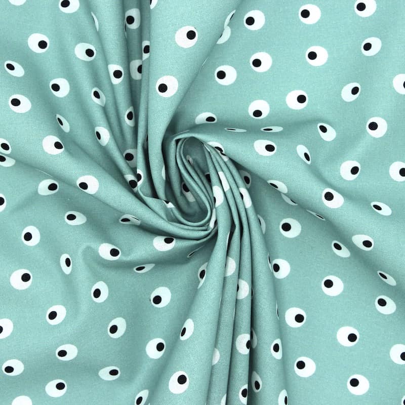Tissu en coton imprimé oeufs durs sur fond turquoise