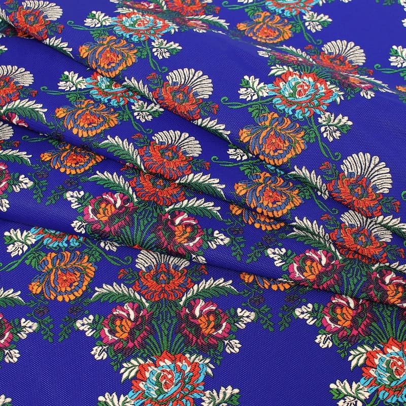 Fabric printed with flowers - blue background