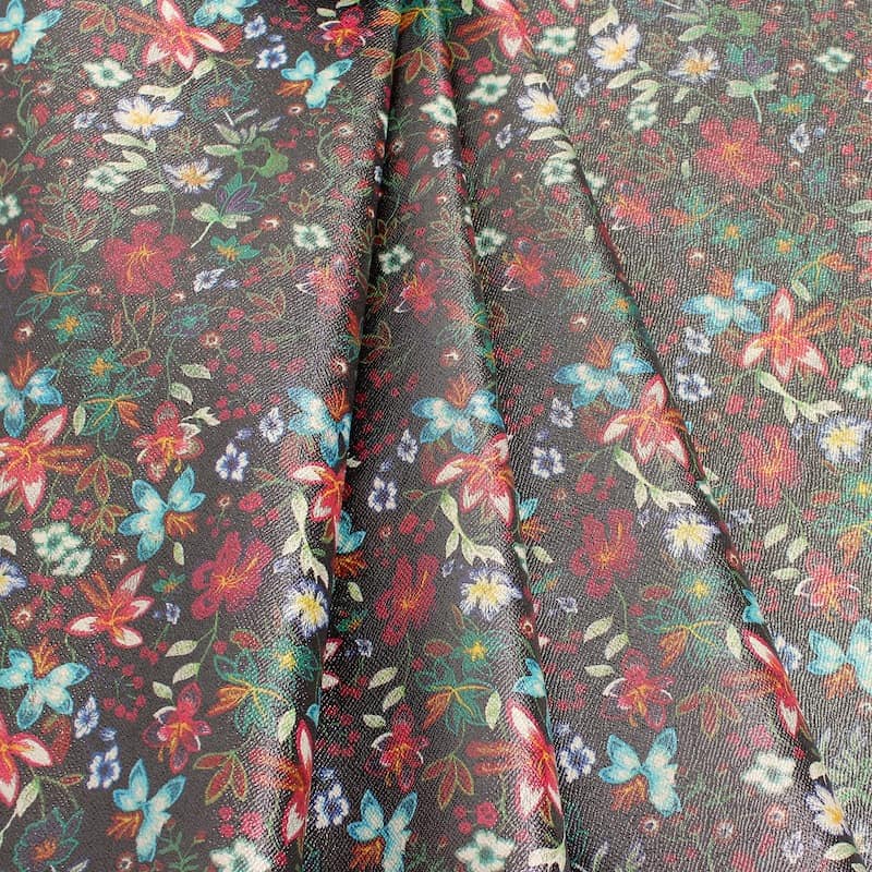 Fabric printed with flowers with silver reflection