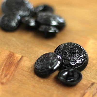 Black metal button with coat or arms