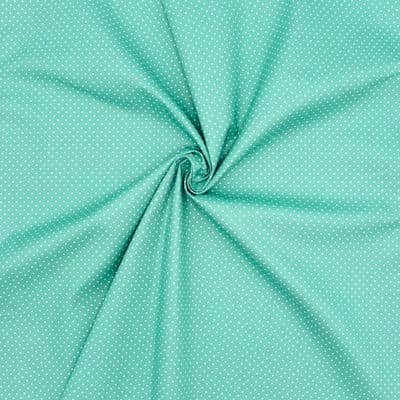 Tissu en coton à pois sur fond turquoise