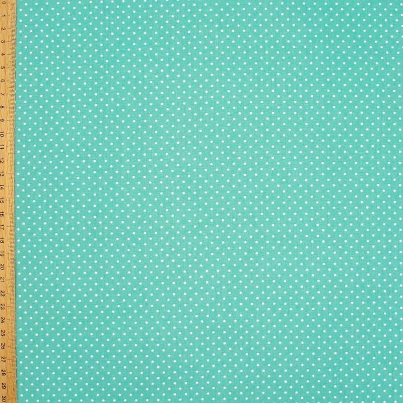 Tissu en coton à pois sur fond turquoise