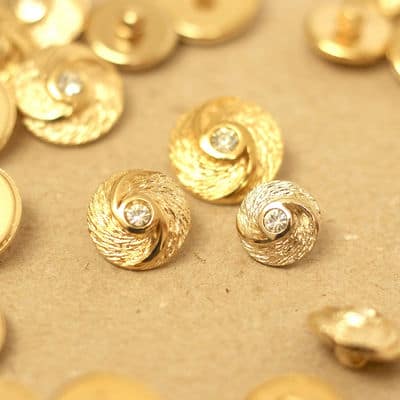 Round button with metal aspect - gold and shiny 
