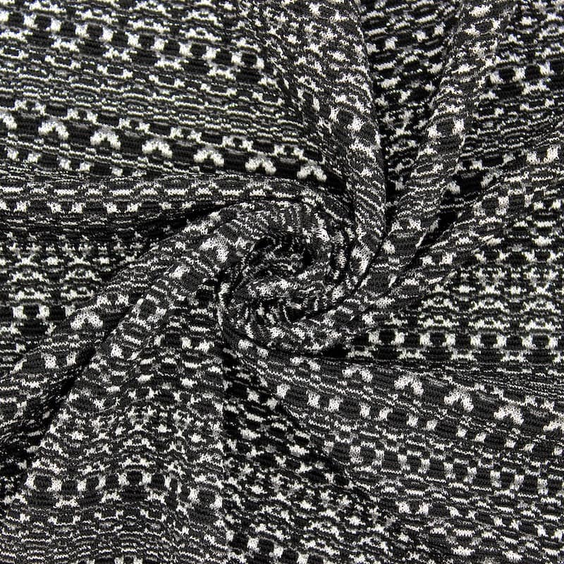 Apparel fabric with silver fantasy thread