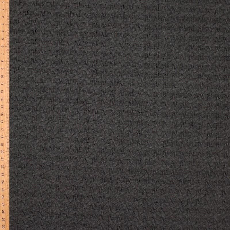 Gebreide stof in polyester met motief in reliëf - zwart