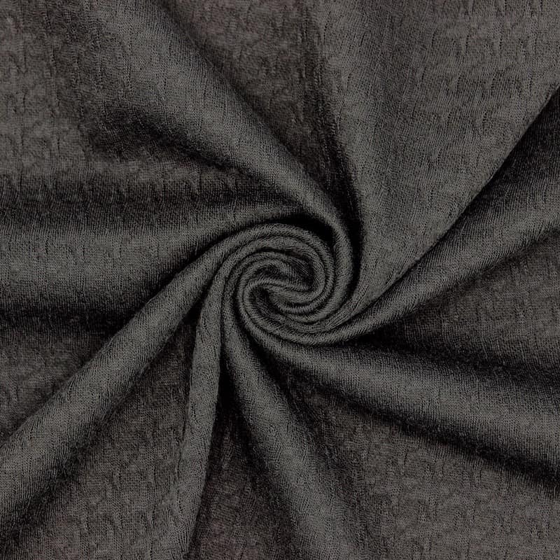 Gebreide stof in polyester met motief in reliëf - zwart