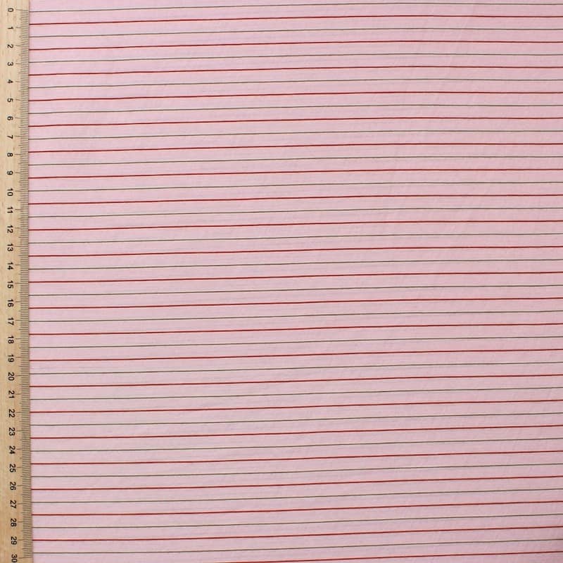 Gestreepte stof in katoen en polyester - roze achtergrond
