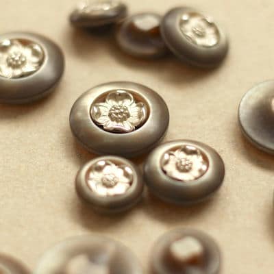 Resin pearly button with silver flowers