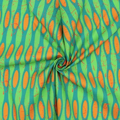 Katoen met grafische motief - groen / oranje