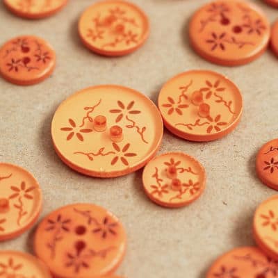 Bouton rond à fleurs en résine orange semi transparent