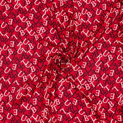 Polyester fabric slightly folded with letters - red
