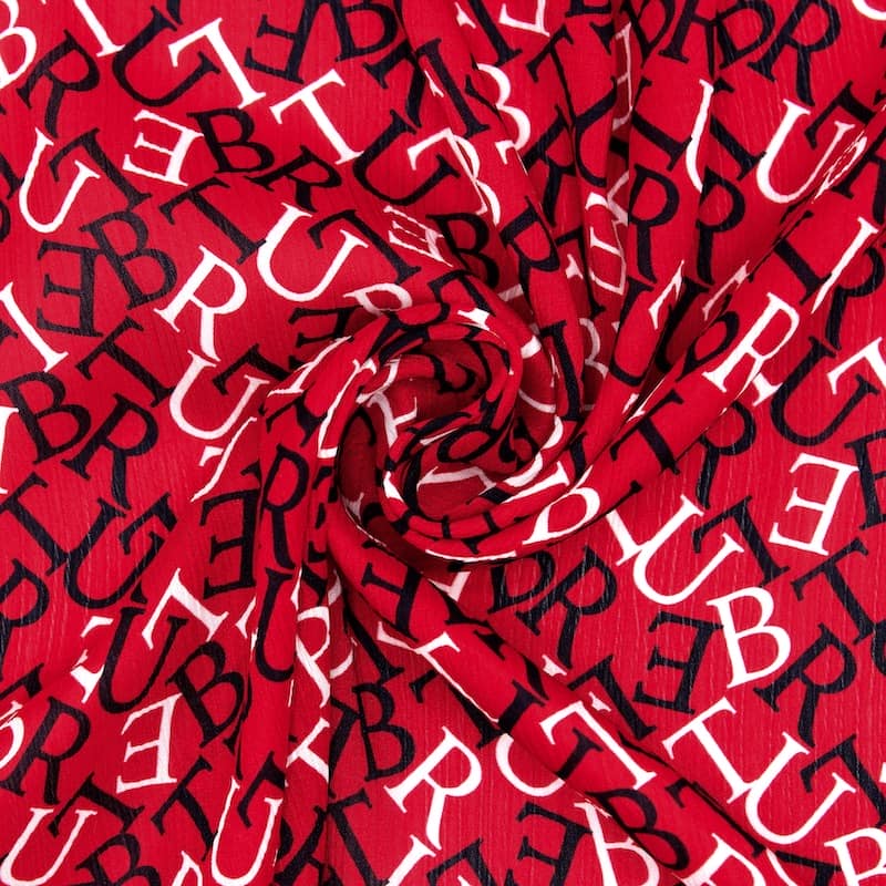 Polyester fabric slightly folded with letters - red