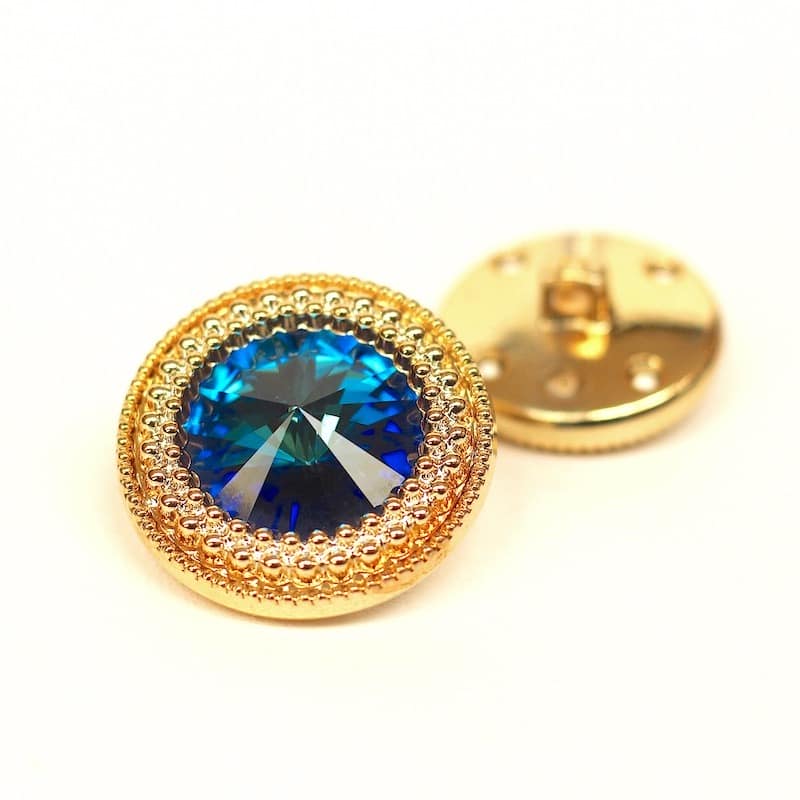 Golden button with cobalt blue rhinestone