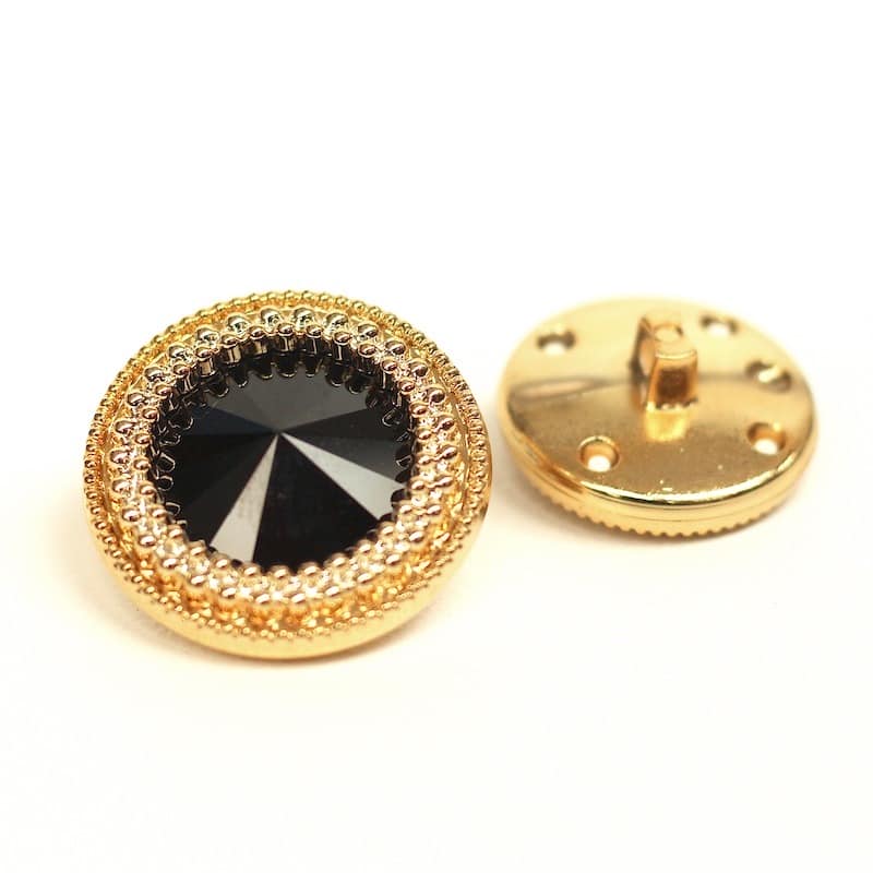 Golden button with black rhinestone