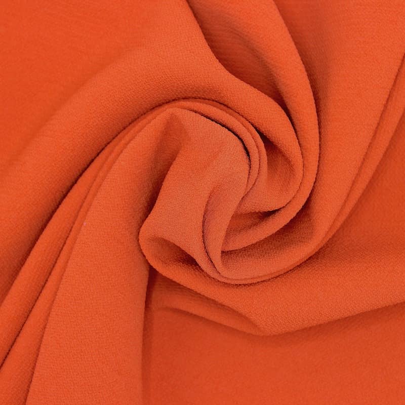 Tissu aspect crêpe orange brûlée