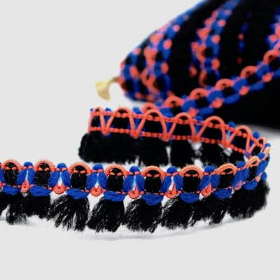 Biesband met pompoms - zwart en blauw 