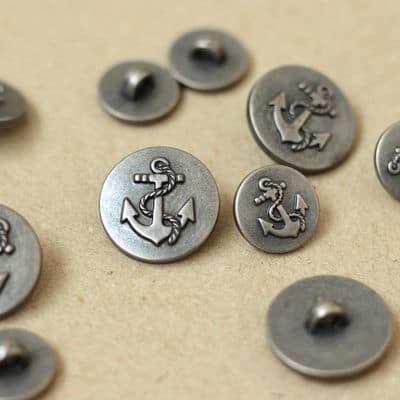 Button with silver grey metal aspect