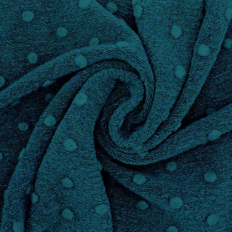Gebreide stof met stippen en aspect van wol - pauwblauw