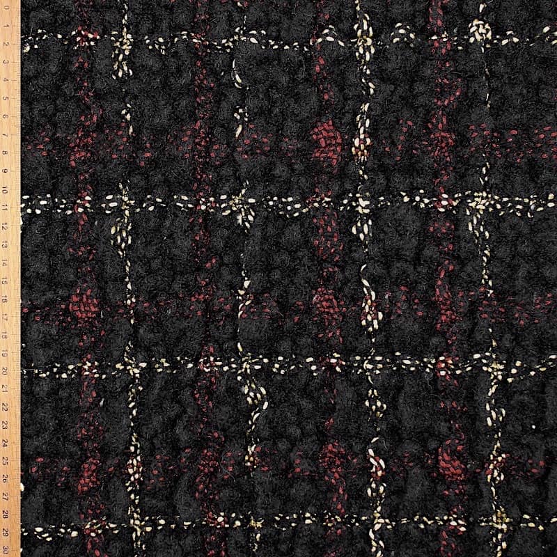 Wool and alpaga fabric with red and white checkered design on black background