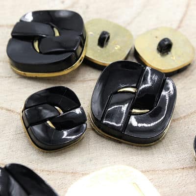 Button with golden metaland black aspect