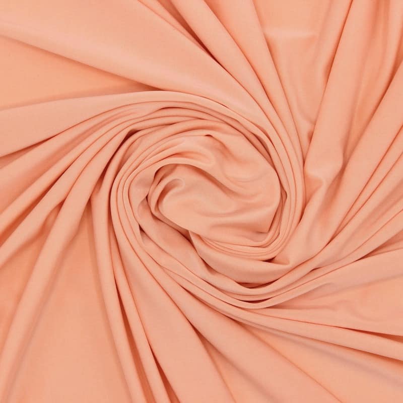 Tissu vestimentaire extensible saumon