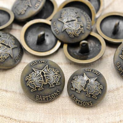Metal button with coat of arms - old gold