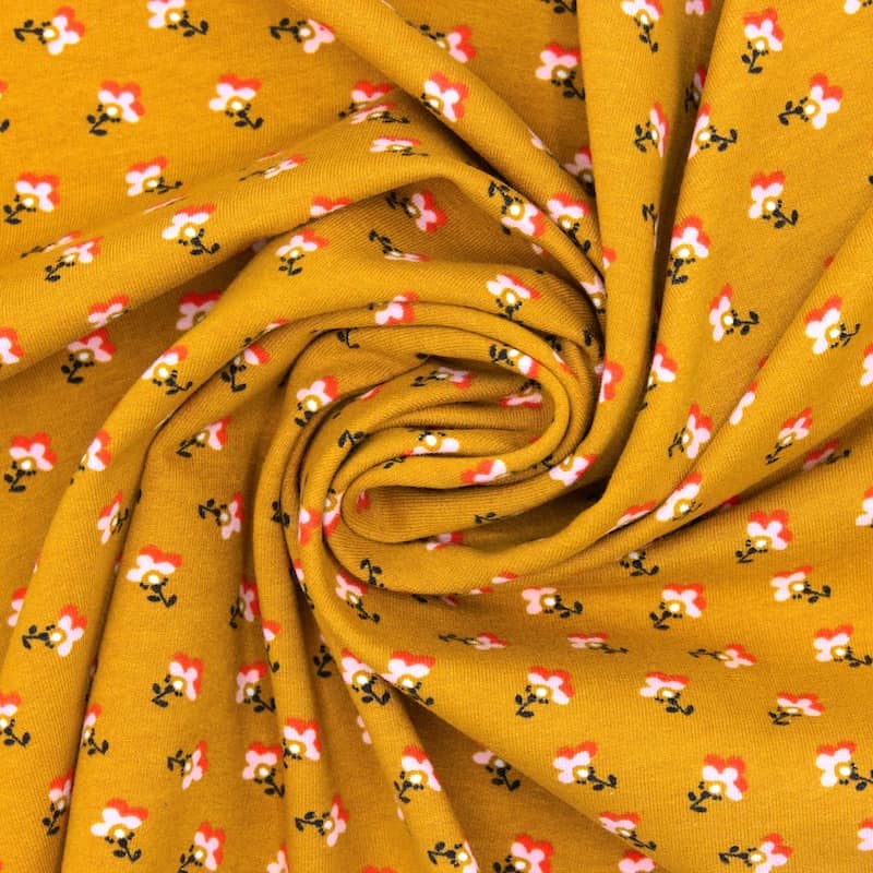French Terry stof met bloemen - mosterdgeel
