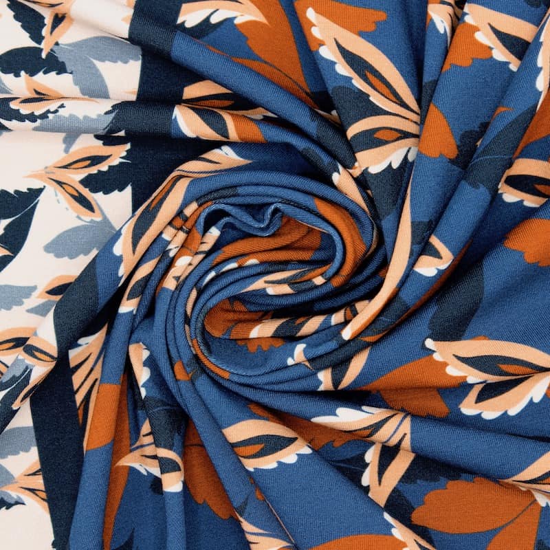 Polyester jerseystof met planten - blauw en roestkleurig