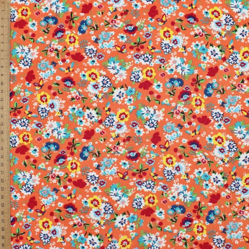Tissu en coton enduit floral - corail