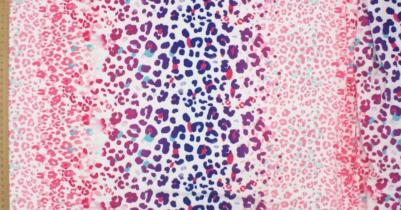 Polyester knit fabric with animal print - pink and blue 