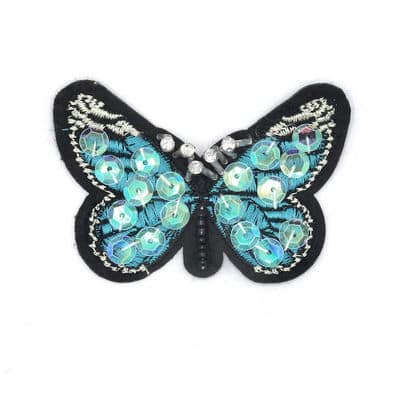 Geborduurde opstrijkbare vlinder met glitters - blauw