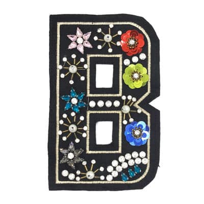 Embroidered "B" badge with pearls and glitters